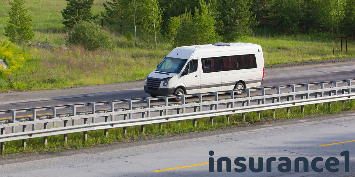 insured minubus driving on a road